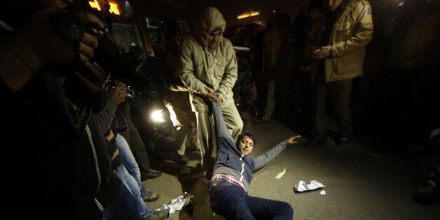 NEW DELHI, INDIA - DECEMBER 20: The Delhi Police detain the protestors of Nirbhaya who were protesting against the release of the juvenile convict in the December 16 gang-rape case at Rajpath on December 20, 2015 in New Delhi, India. The man, who was 17 at the time of the crime and cannot be named, was sentenced to three years in a reform facility in August 2013 and finished his term this weekend. On Friday, Delhi High Court rejected a petition to extend the sentence, saying that the man had served the maximum under the law. Several activists and politicians demanded that he should not be released until it could be proven that he had been reformed. Indiaâs Supreme Court is set to hear another petition on Monday. (Photo by Ravi Choudhary/Hindustan Times via Getty Images)