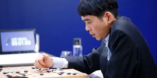 South Korean professional Go player Lee Sedol reviews the match after finishing the third match of the Google DeepMind Challenge Match against Google's artificial intelligence program, AlphaGo, in Seoul, South Korea, Saturday, March 12, 2016. Google's Go-playing software defeated a human champion for the third straight time Saturday to clinch the best-of-five series and establish its superiority in an ancient Chinese game long thought to be the realm of humans. (AP Photo/Lee Jin-man)