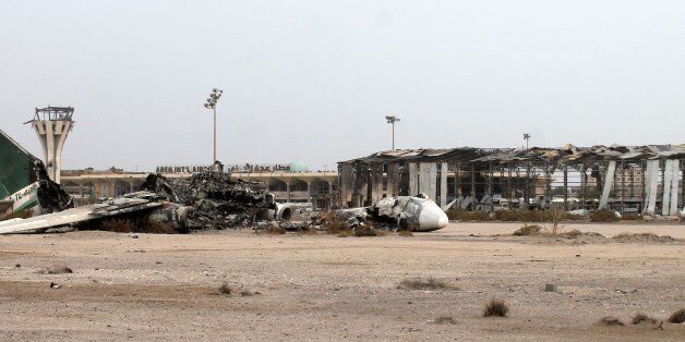 The debris of a plane is seen on the tarmac at Aden's international airport on July 14, 2015 after armed militiamen loyal to Yemen's fugitive President Abderabbo Mansour Hadi recaptured it from Shiite Huthi rebels. Loyalists of Yemen's exiled president recaptured the airport in second city sealing a four-month battle with Iran-backed rebels with Saudi-led air and naval support, military sources said. AFP PHOTO / SALEH AL-OBEIDI (Photo credit should read SALEH AL-OBEIDI/AFP/Getty Images)