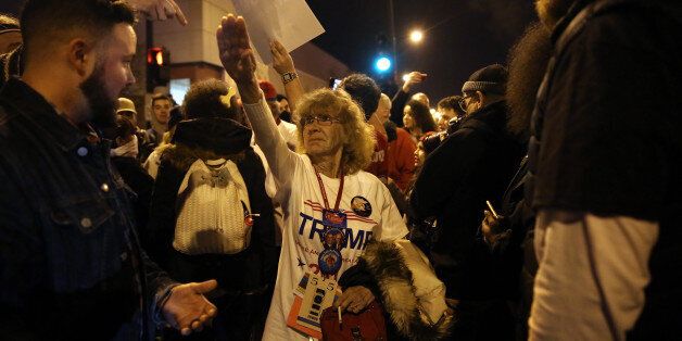 Donald Trump supporter Birgitt Peterson of Yorkville, Ill., argues with protesters outside the UIC Pavilion after the cancelled rally for the Republican presidential candidate in Chicago on Friday, March 11, 2016. (E. Jason Wambsgans/Chicago Tribune/TNS via Getty Images)