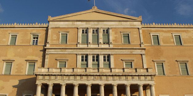 The Hellenic Parliament (Vouli ton Ellinon) is the seat of the Greek government, located in the neoclassical Old Royal Palace, overlooking Syntagma Square in Athens, Greece. The Greek Presidential Guard (Evzones) stands in front of the building.