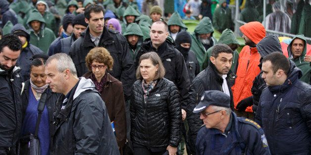 US Assistant Secretary of State for European and Eurasian Affairs Victoria Nuland, center, visits the Greek border camp near Idomeni, Thursday, March 10, 2016. Northbound borders are closed and authorities plan to distribute fliers telling refugees seeking to reach central Europe that ?there is no hope of you continuing north, therefore come to the camps where we can provide assistance as more than 36,000 transient migrants are thought to be stuck in financially struggling Greece. (AP Photo/Visar Kryeziu)