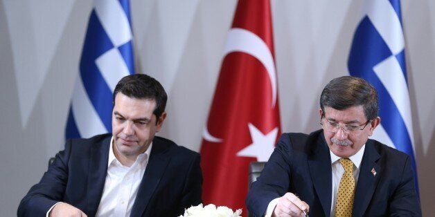 IZMIR, TURKEY - MARCH 08: Turkish Prime Minister Ahmet Davutoglu (R) and Greek Prime Minister Alexis Tsipras (L) hold a joint press conference at the end of the Fourth Meeting of High Level Cooperation Council in Izmir, Turkey on March 08, 2016. (Photo by Abdulhamid Hosbas/Anadolu Agency/Getty Images)