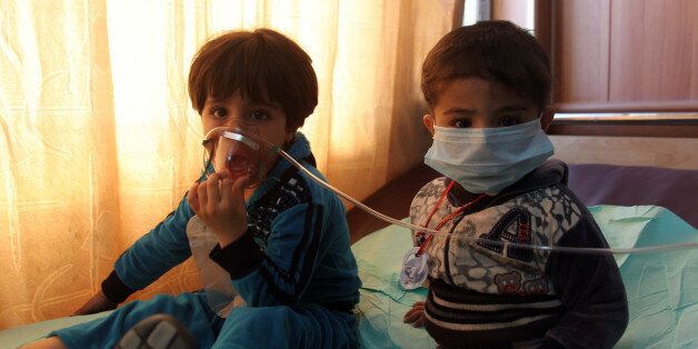 KIRKUK, March 9, 2016 -- Two kids are seen at a hospital after mortar shells from the Islamic State militants targeted the Taza town south of Kirkuk city in northern Iraq on March 9, 2016. At least eight people were wounded during the bombing on Wednesday. (Xinhua/Ako Zangana via Getty Images)