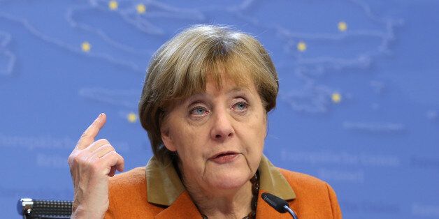 German Chancellor Angela Merkel gestures while speaking during a media conference at an EU summit in Brussels on Tuesday, March 8, 2016. European Union leaders said early Tuesday they reached the outlines for a possible deal with Ankara to return thousands of migrants to Turkey and said they were confident a full agreement could be reached at a summit next week. (AP Photo/Francois Walshaerts)