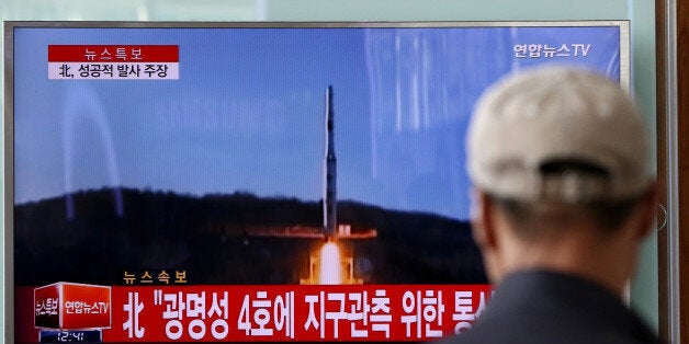 People watch a television screen showing a news broadcast on North Korea's long-range rocket launch at Seoul Station in Seoul, South Korea, on Sunday, Feb. 7, 2016. North Korea launched a long-range rocket Sunday, just weeks after conducting a fourth nuclear test in the latest setback for international efforts to pressure the Kim Jong Un regime to end its weapons program. Photographer: SeongJoon Cho/Bloomberg via Getty Images