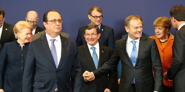 BRUSSELS, BELGIUM - MARCH 7: Turkish Prime Minister Ahmet Davutoglu (C), French President Francois Hollande (L 2), President of the European Council, Donald Tusk (R 3), Lithuanian President Dalia Grybauskaite (L) and Dutch Prime Minister Mark Rutte (R) pose for a photo after the EU-Turkey summit in Brussels, Belgium on March 7, 2016. (Photo by Turkish Prime Ministry / Mustafa Aktas/Anadolu Agency/Getty Images)
