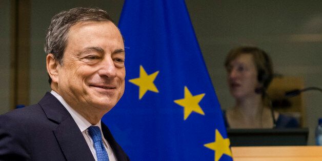 FILE - In this Nov. 12, 2015 file photo the President of the European Central Bank Mario Draghi arrives to address the committee on economic and monetary affairs at the European parliament in Brussels. (AP Photo/Geert Vanden Wijngaert, file)