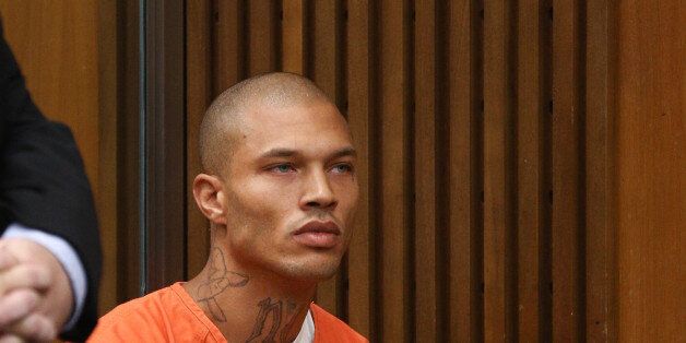 STOCKTON, CA - JULY 08: Jeremy Meeks, right, makes a court appearance with his attorney Tai Bogan July 8, 2014 in Stockton, California. During his brief appearance the state agreed to let federal prosecutors take over Meeks' case. Meeks was arrested on felony weapon charges June 18 as part of a Stockton police gang sweep. His booking photo was posted to the Stockton police Facebook page and has garnered media attention and secured him a Hollywood agent due to his model-like features. (Photo by Elijah Nouvelage/Getty Images)
