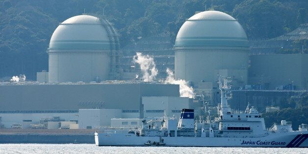 This picture taken on February 26, 2016 shows Kansai Electric Power's number 3 (L) and number 4 (R) reactors at the Takahama nuclear plant in western Japan's Fukui prefecture. A Japanese utility on February 29 said that a surprise glitch has switched off a nuclear reactor just days after it was turned on again after a nationwide shutdown following the 2011 Fukushima crisis. JAPAN OUT AFP PHOTO / JIJI PRESS / AFP / JIJI PRESS / JIJI PRESS (Photo credit should read JIJI PRESS/AFP/Getty Images)