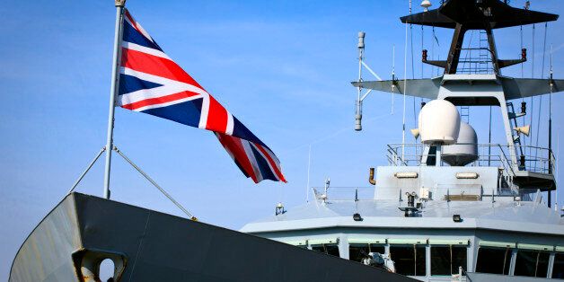 British battleship displaying its Union Jack.
