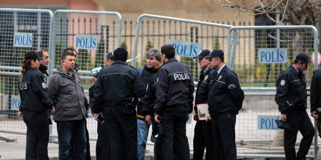 Security and forensic officials work at the site of Sunday's explosion in the busy center of Turkish capital, Ankara Monday, March 14, 2016. The explosion is believed to have been caused by a car bomb that went off close to bus stops. (AP Photo/Burhan Ozbilici)