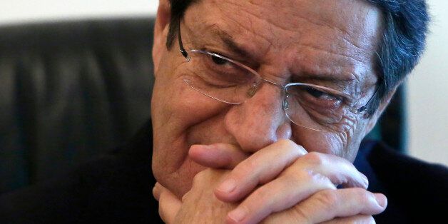 Cyprus' President Nicos Anastasiades speaks to the Associated Press during an interview at his office in the presidential palace in capital Nicosia in this divided Mediterranean island of Cyprus, Friday, Jan. 15, 2016. Cyprusâ president says talks aimed at reunifying the ethnically divided Mediterranean island could conclude in a peace deal this year. (AP Photo/Petros Karadjias)