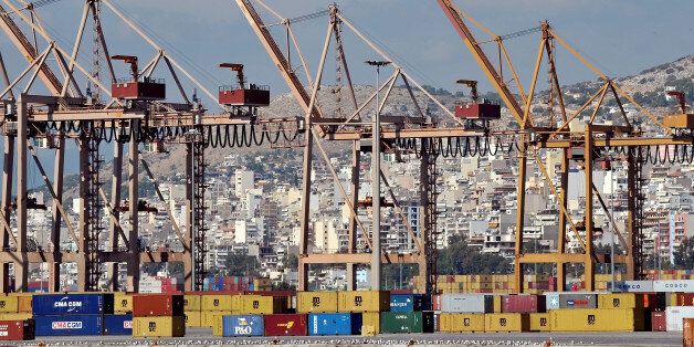 Cranes stand unmanned on a dockside during a strike at the container terminal in Piraeus on October 12, 2009. The empty , due to the strike, container terminal is pictured on October 12, 2009 in Piraeus. Workers of the Piraeus Port Authority (OLP) continued their strike, protesting against the handover of terminal management services to Chinaï¿½s Cosco Pacific. AFP PHOTO /LOUISA GOULIAMAKI (Photo credit should read LOUISA GOULIAMAKI/AFP/Getty Images)