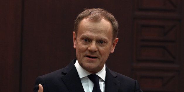 European Council President Donald Tusk speaks to the media during a joint press conference with Turkish Prime Minister Ahmet Davutoglu in Ankara, Turkey, Thursday, March 3, 2016. Tusk says it is up to Turkey to decide what further measures it can take to reduce the flow of migrants but says many in Europe favor a mechanism that would allow the âfast and large-scaleâ shipment of migrants back to Turkey and such a mechanism would âeffectively break the business model of the smugglers.(AP Photo/Burhan Ozbilici)