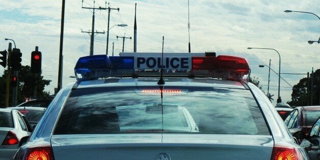 Behind a police car at the traffic lights. Hoping that they aren't gonna tell me off for doing photography while waiting for the lights to change. Not quite in the same league as texting while driving!