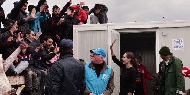 UNHCR's Goodwill Ambassador Angelina Jolie greets refugees and migrants in the port of Piraeus during a visit on March 16, 2016. Some 4000 refugees and migrants are stranded in the port due to Balkans route closure. European leaders scrambled Wednesday to salvage an under-fire deal with Turkey to ease the migrant crisis with a round of shuttle diplomacy on the eve of a crunch summit. / AFP / LOUISA GOULIAMAKI (Photo credit should read LOUISA GOULIAMAKI/AFP/Getty Images)