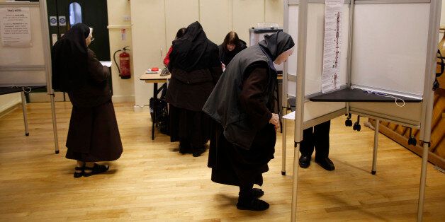Carmelite Sisters prepare to cast their vote in North Dublin, Ireland, Friday, Feb. 26, 2016. Ireland began voting early on Friday in the country's General Election where recent polls suggest that the outcome could leave no party able to lead a stable coalition. (AP Photo/Peter Morrison)