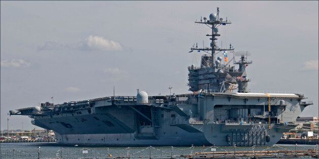 Per Wikipedia:"The USS Harry S Truman (CVN-75) is the eighth Nimitz-class supercarrier of the U. S. Navy, named after the 33rd President of the United States, Harry S Truman. (The ship is also known as 'HST' within the Navy.)HST's call sign is Lone Warrior, and she is currently home-ported at the Norfolk (VA) Naval Station.The Truman was launched in September 1996 by Newport News Shipbuilding, Newport News (VA), and commissioned in July 1998, with President Bill Clinton as the keynote speaker.The Truman was initially the flagship of Carrier Group Two and, beginning in October 2004, of Carrier Strike Group Ten.Beginning in 2001, the Truman Carrier Battle Group participated in Operation Joint Endeavor, Operation Deny Flight, Operation Southern Watch, Operation Enduring Freedom â Afghanistan, Operation Iraqi Freedom, Summer Pulse '04, and NATO Operation Medshark/Majestic Eagle '04.The Truman is 1,092 ft long, 257 ft wide, and is as high as a twenty-four-story building, at 244 feet. She can accommodate approximately 80 aircraft and has a flight deck 4.5 acres in size, using four elevators that are 3,880 ftÂ² each, to move planes between the flight deck and the hangar bay. With a combat load, HST displaces almost 97,000 tons and can accommodate 6,250 crew members.launchers. The ship cost over $4.5 billion in 2007 dollars to manufacture.The Truman is powered by two Westinghouse A4W nuclear reactors, turning 4 five-bladed screw propellers that weigh 66,220 pounds each, and that can drive the ship at speeds over 30 knots. By using nuclear fuel, the ship is capable of steaming more than three million miles before refueling.The Nimitz-class supercarriers are a class of ten nuclear-powered aircraft carriers in service with the U. S. Navy, numbered with consecutive hull numbers between CVN-68 and CVN-77."Photo by Ron Cogswell on September 22, 2012, using a Nikon D80 and minor Photoshop effects.DSC_0225