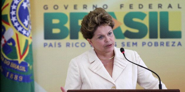 Brazilâs President Dilma Rousseff speaks during a ceremony where she announced an economic stimulus package at Planalto presidential palace in Brasilia, Brazil, Wednesday, June 27, 2012. The program announced by Rousseff focuses on a wide array of government purchases, from backhoes to motorcycles to military equipment. Rousseff says the government will use stimulus packages