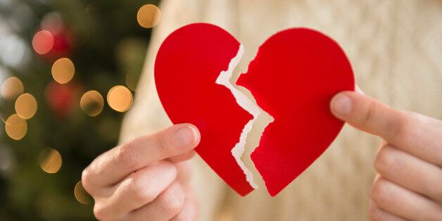 Studio Shot of female's hands holding broken heart