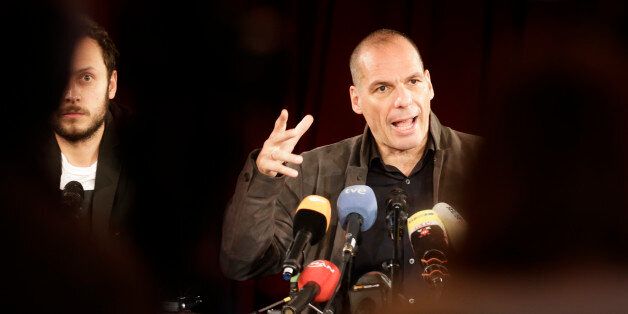 Former Greek finance minister Yanis Varoufakis, right, attends a news conference about the launch of a new left-wing pan-Europe political movement called 'Democracy in Europe Movement 2025' in Berlin, Germany, Tuesday, Feb. 9, 2016. Sitting at left is Croatian philosopher and author Srecko Horvat. (AP Photo/Markus Schreiber)