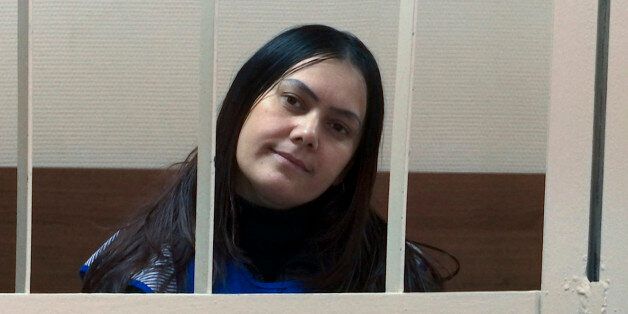 In this frame grab made from the APTN footage, Gulchekhra Bobokulova from Uzbekistan appears in a court room in Moscow, Russia, Wednesday, March 2, 2016. The 38 year old nanny is accused of killing a 4-year-old girl and then waving the child's severed head outside a Moscow subway station. A Moscow court on Wednesday sanctioned her arrest for two months. (Vladimir Kondrashov/APTN via AP)