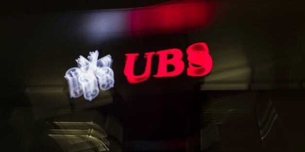 A picture taken on February 25, 2016 shows the logo of the Swiss global financial services company UBS at the entrance of a branch's building in Zurich. / AFP / FABRICE COFFRINI (Photo credit should read FABRICE COFFRINI/AFP/Getty Images)