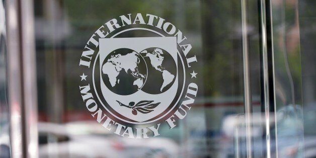 The seal of the International Monetary Fund is seen at the headquarters building in Washington, DC on July 5, 2015. The euro was dropping against the dollar after early results of the Greece bailout referendum suggested the country rejected fresh austerity demands from EU-IMF creditors. AFP PHOTO/MANDEL NGAN (Photo credit should read MANDEL NGAN/AFP/Getty Images)