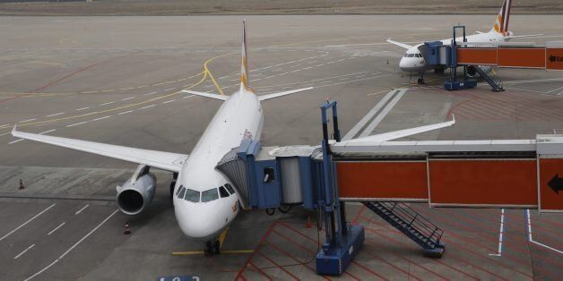 Germanwings aircrafts are parked at the airport in Cologne, Wednesday March 25, 2015, a day after a Germanwings aircraft crashed in France on the way from Barcelona, Spain, to Duesseldorf, Germany, killing 150 people. (AP Photo Frank Augstein)