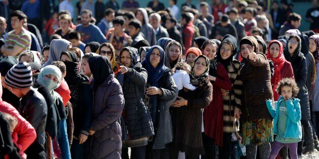 Refugees and migrants, mostly from Afghanistan, wait in queues to receive food distributed by the Greek army at a transit camp in the western Athens' suburb of Schisto, Thursday, Feb. 25, 2016. Balkan border controls leave thousands people stranded in Greece as the country scrambles to cope with border restrictions imposed recently by Austria and Balkan countries â while some 4,000 migrants and refugees continue to arrive on Greek territory daily. (AP Photo/Thanassis Stavrakis)