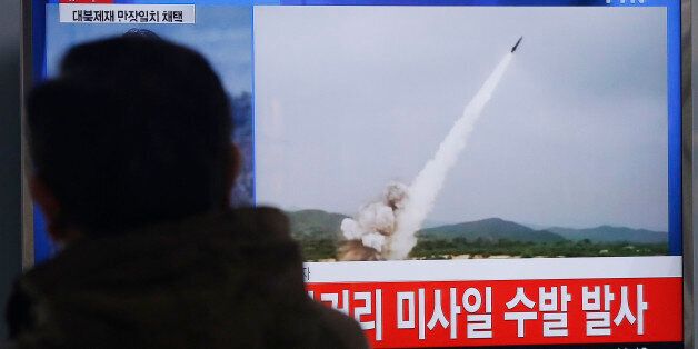 A man watches a TV news program showing a file footage of the missile launch conducted by North Korea, at Seoul Railway Station in Seoul, South Korea, Thursday, March 3, 2016. North Korea fired several short-range projectiles into the sea off its east coast Thursday, Seoul officials said, just hours after the U.N. Security Council approved the toughest sanctions on Pyongyang in two decades for its recent nuclear test and long-range rocket launch. The screen reads
