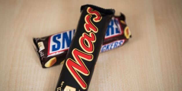 A Mars and a Snickers bar can be seen in Berlin on February 23, 2016.'All sweets of the brand Mars and Snickers with a best before date from June 19, 2016 to January 8, 2017 should not be consumed,' the company said, adding that the recall also applied to chocolates branded 'Milk Way Minis and Celebrations packs'. / AFP / ODD ANDERSEN (Photo credit should read ODD ANDERSEN/AFP/Getty Images)