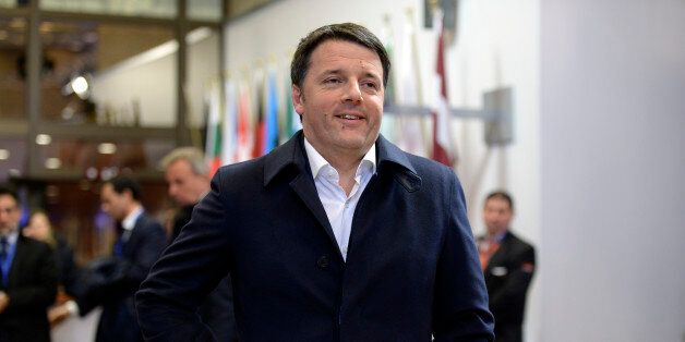 Italian Prime Minister Matteo Renzi leaves after the working dinner at the end of an European Union (EU) summit in Brussels, on February 19, 2016. European leaders sealed a deal with the UK after hours of haggling at a marathon summit, paving the way for a referendum on whether Britain will stay in the EU. The European Union's two top figures, Donald Tusk and Jean-Claude Juncker, presented its 28 leaders with draft proposals at a long-delayed dinner after hours of painstaking face-to-face talks