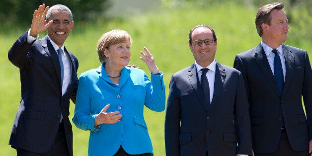 From left, US President Barack Obama, German Chancellor Angela Merkel, French President Francois Hollande and British Prime Minister David Cameron, gather to pose for a group photo during the G-7 summit in Schloss Elmau hotel near Garmisch-Partenkirchen, southern Germany, Sunday, June 7, 2015. (AP Photo/Carolyn Kaster)