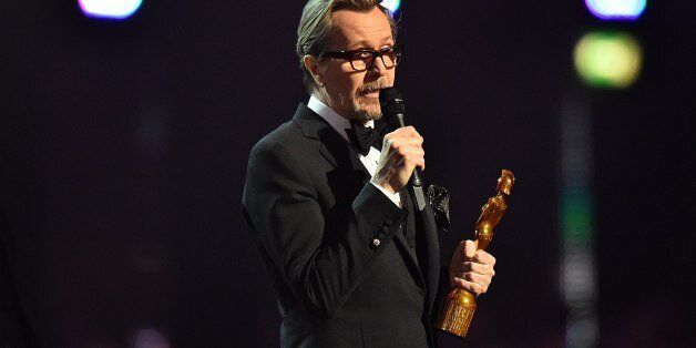 Gary Oldman accepts the Brits Icon Award on behalf of the late David Bowie on stage during the 2016 Brit Awards at the O2 Arena, London.