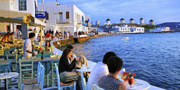 Tourists relaxing at Mykonos