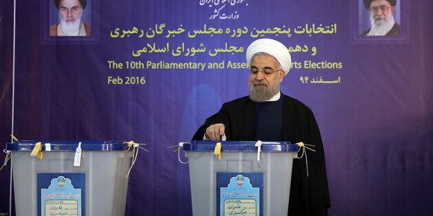 In this photo released by official website of the office of the Iranian Presidency, President Hassan Rouhani casts his ballot for parliamentary elections in Tehran, Iran, Friday, Feb. 26, 2016. Iranians were voting on Friday in parliamentary elections, the country's first since its landmark nuclear deal with world powers last summer. At the same time as parliamentary elections, Iranians are also voting for the Assembly of Experts, a clerical body empowered to choose or dismiss the country's supreme leader. (Iranian Presidency Office via AP)