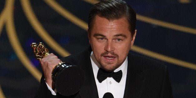 Actor Leonardo DiCaprio accepts the award for Best Actor in,The Revenant on stage at the 88th Oscars on February 28, 2016 in Hollywood, California. AFP PHOTO / MARK RALSTON / AFP / MARK RALSTON (Photo credit should read MARK RALSTON/AFP/Getty Images)