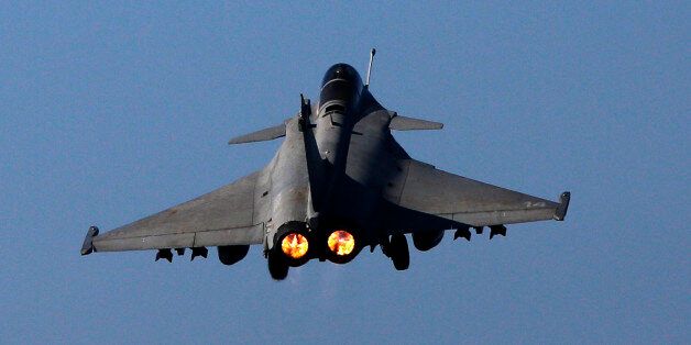 A Rafale fighter jet is catapulted for a mission, on France's flagship Charles de Gaulle aircraft carrier in the Persian Gulf, Tuesday, Jan. 12, 2016. The Charles de Gaulle joined the U.S.- led coalition against Islamic State in November, as France intensified its airstrikes against extremist sites in Syria and Iraq in response to IS threats against French targets. (AP Photo/Christophe Ena)