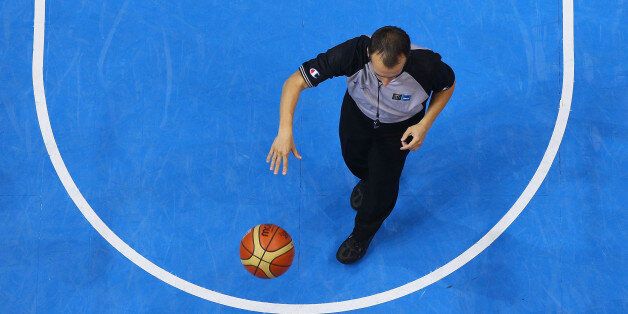 SIAULIAI, LITHUANIA - SEPTEMBER 05: A basketball referee hols the ball during the EuroBasket 2011 first round group B match between Latvia and Germany at Siauliai Arena on September 5, 2011 in Siauliai, Lithuania. (Photo by Christof Koepsel/Bongarts/Getty Images)