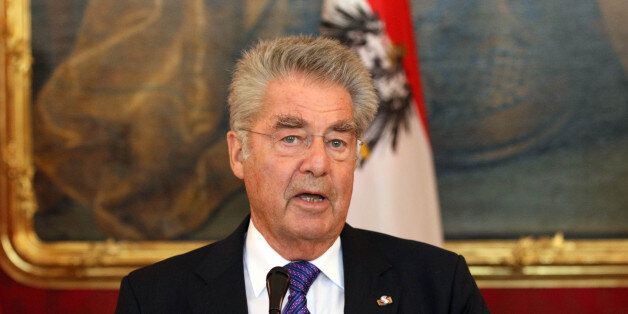 Austrian President Heinz Fischer adress the media after talks with President of Montenegro Filip Vujanovic and the Chairman of Bosnian tripartite Presidency Dragan Covic at the Hofburg palace in Vienna, Austria, Wednesday, Aug. 26, 2015. (AP Photo/Ronald Zak)
