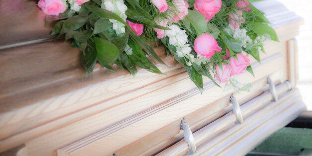 Funeral flowers atop a casket