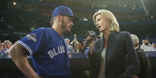 TORONTO, CANADA - OCTOBER 21: Josh Donaldson #20 of the Toronto Blue Jays is interviewed by Erin Andrews of Fox Sports after their victory against the Kansas City Royals during game five of the American League Championship Series at Rogers Centre on October 21, 2015 in Toronto, Ontario, Canada. (Photo by Tom Szczerbowski/Getty Images)