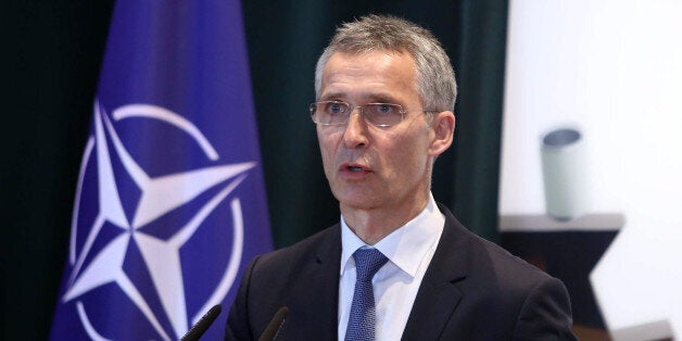 NATO Secretary General Jens Stoltenberg answers media questions during a joint press conference after his meeting with Albanian Prime Minister Edi Rama, not pictured, in Tirana, Albania, Thursday, Dec. 10, 2015. NATO Secretary General Jens Stoltenberg arrive in Tirana on a one day official visit. (AP Photo/Hektor Pustina)