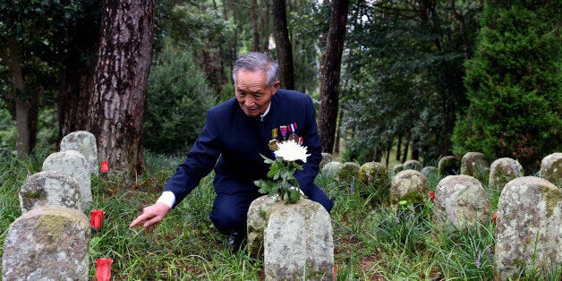 TENGCHONG, July 23, 2015-- Lu Caiwen, 90-year-old veteran, mourns for his dead comrades of the Chinese Expeditionary Force who died while fighting the Japanese army in World War II in Myanmar, at a martyrs' cemetery in Tengchong, a border town in southwest China's Yunnan Province, July 21, 2015. The cemetery was established in 1945 to honor deceased soldiers of the Chinese Expeditionary Force that reclaimed Tengchong from Japanese forces. (Xinhua/Lin Yiguang via Getty Images)