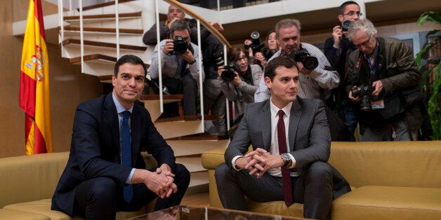 Spain's Socialist Party leader Pedro Sanchez, left, and Ciudadanos Party president Albert Rivera pose for the media before their meeting at the Spanish parliament in Madrid, Thursday, Feb. 4, 2016. The meeting between Sanchez and Rivera is a part of the negotiation rounds to try to form a government after elections. (AP Photo/Francisco Seco)