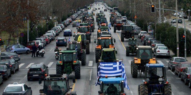 Farmers driving tractors demonstrate against a controversial pension reform in the center of Thessaloniki on 5 February, 2016. / AFP / SAKIS MITROLIDIS (Photo credit should read SAKIS MITROLIDIS/AFP/Getty Images)