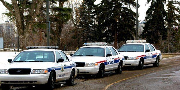 Campus Peace Officer car and two Edmonton City Police cars.