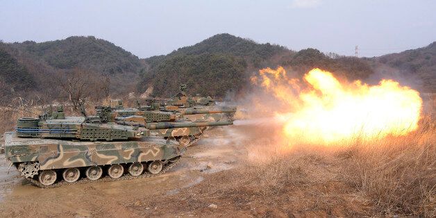 South Korean army K-2 tanks fires during a live firing drill at a fire training field in Yangpyeong, South Korea, Thursday, Feb. 18, 2016. North Korean leader Kim Jong Un recently ordered preparations for launching
